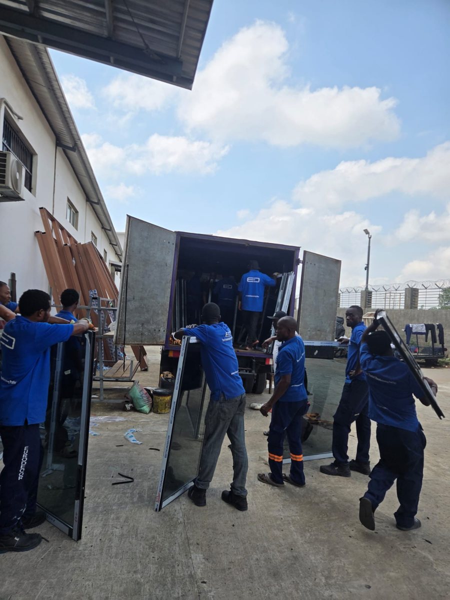 The crew loading framed glass onto the truck