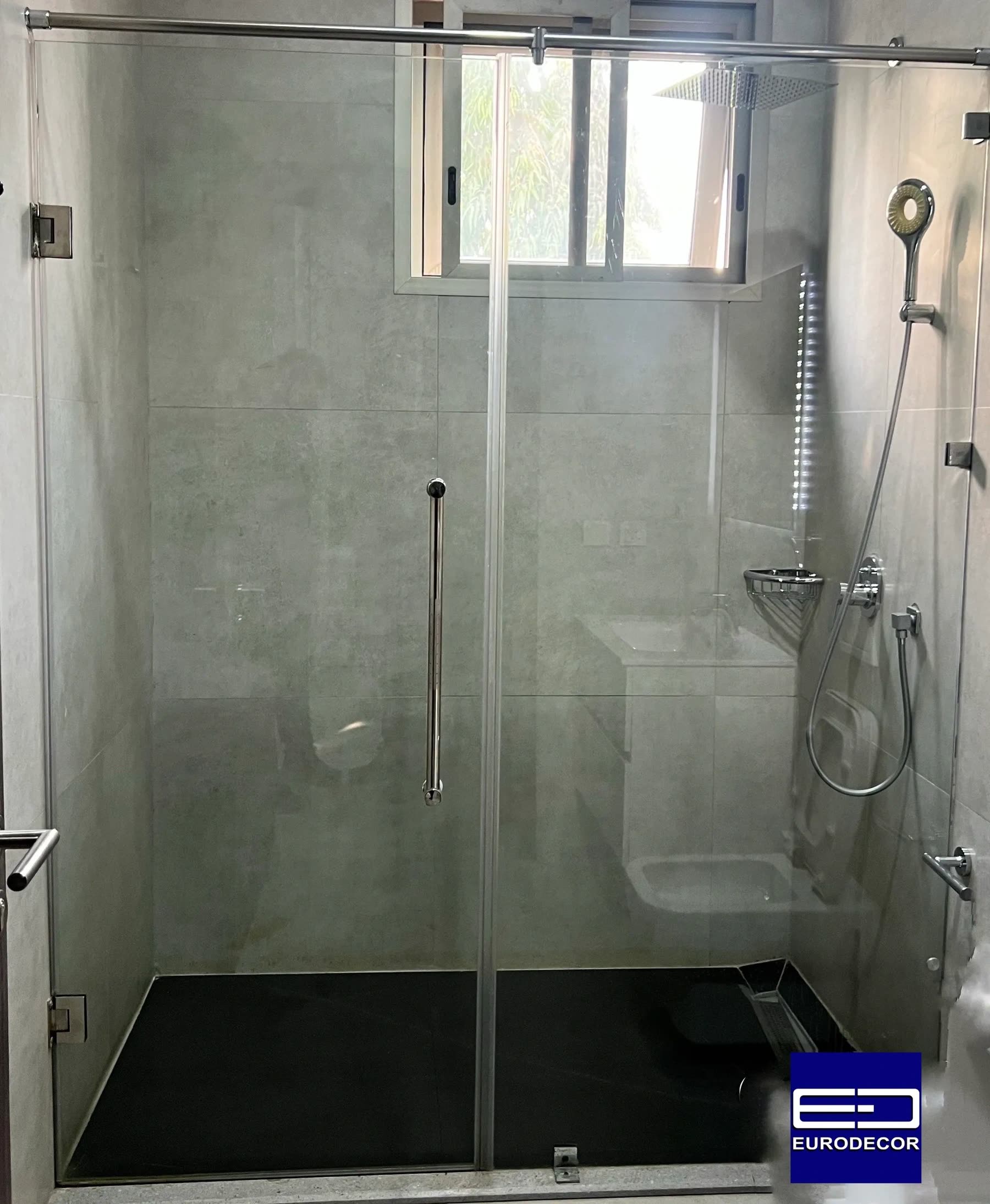 A clear glass shower enclosure